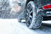 Snowy country road with car on winter day, closeup. Space for text, Snowy country road with car on winter day, closeup. Space for te